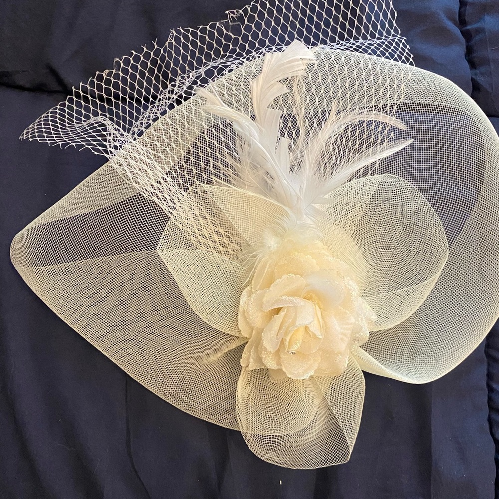 Cream coloured fascinator